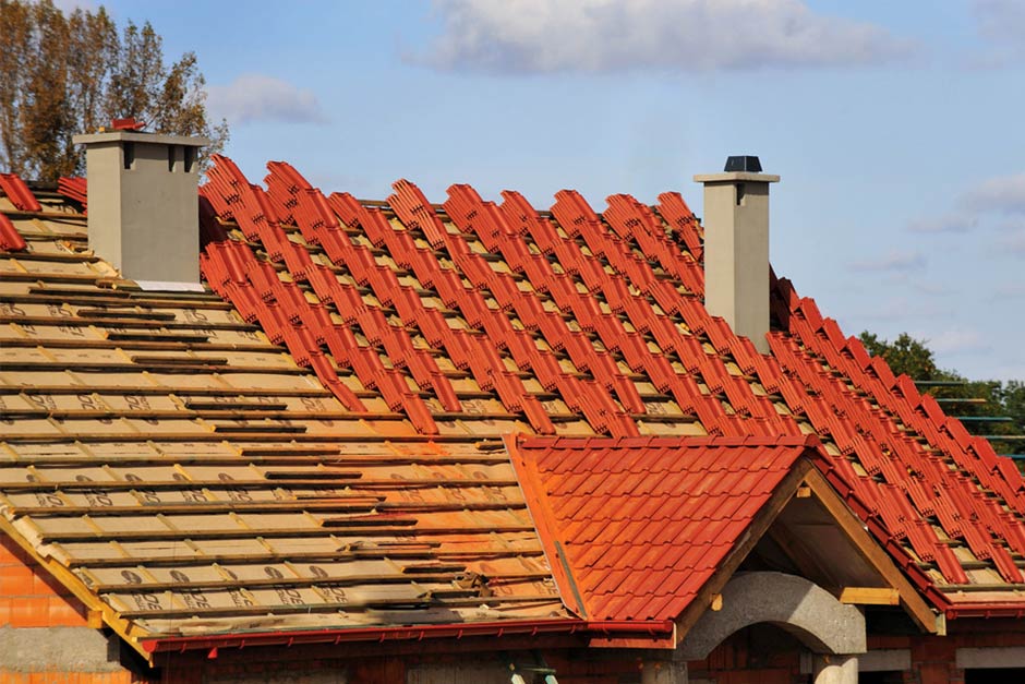 house roof in the process of a roof replacement