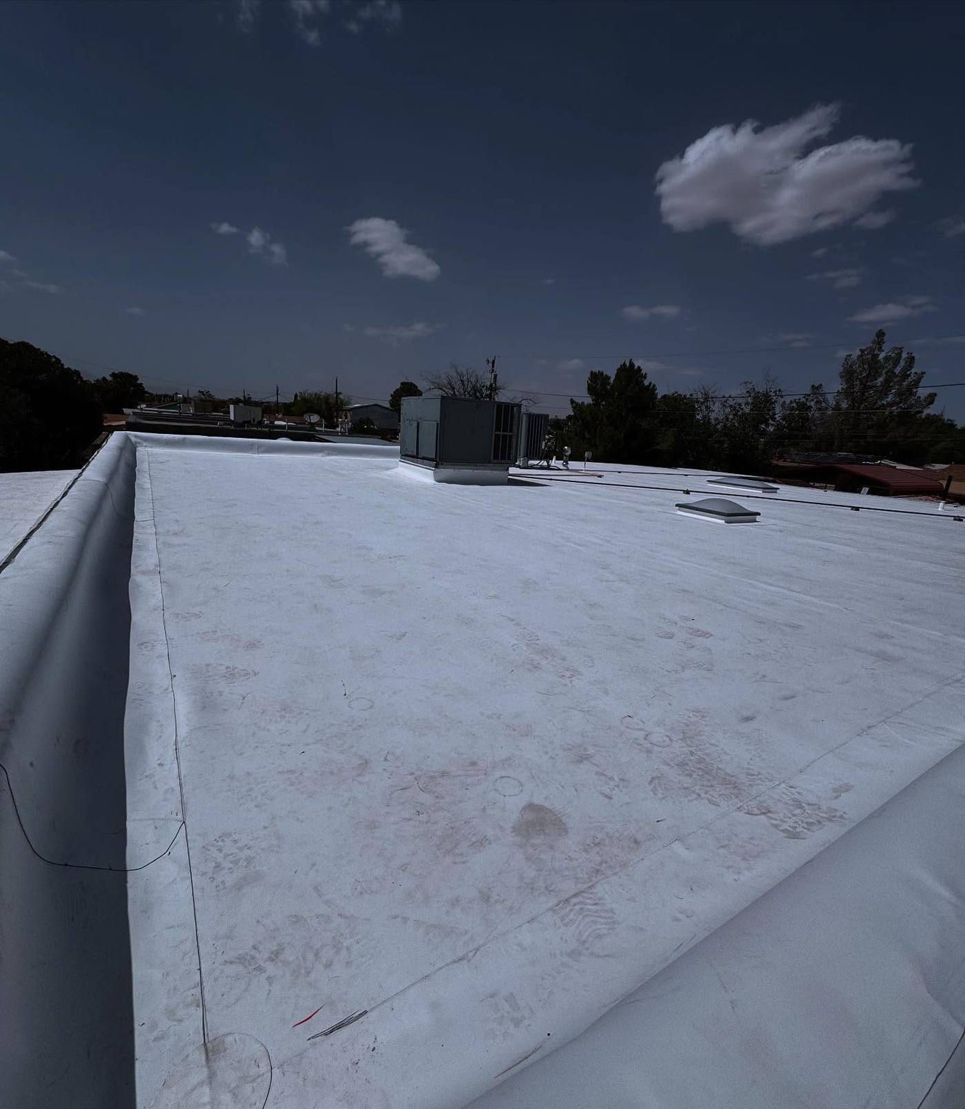 Finished white flat roof surface in El Paso
