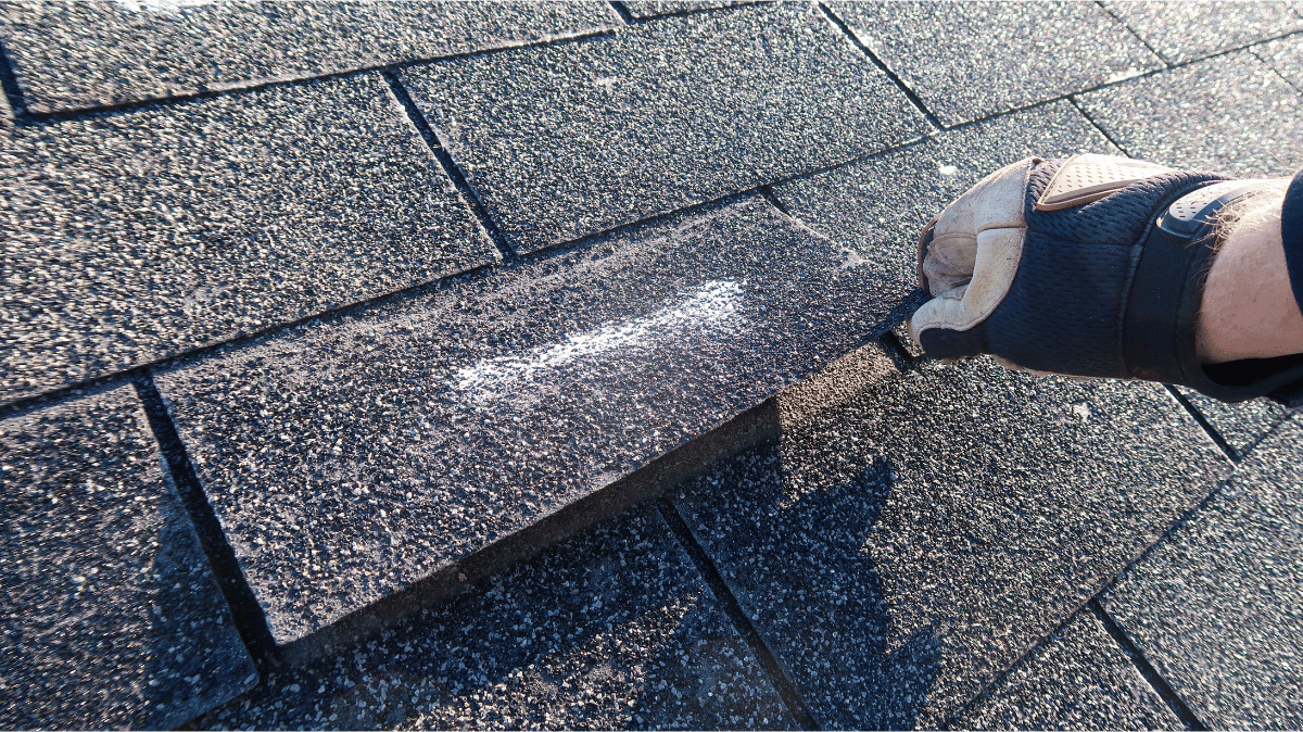 A damaged roof being repaired